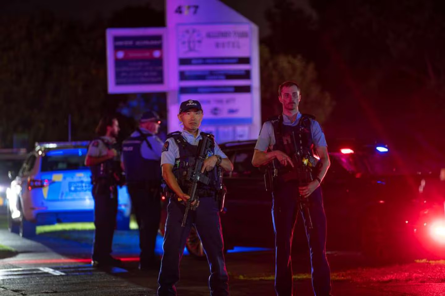 Armed police on Great South Rd, Papatoetoe, Auckland, which was closed due to a firearm incident at a hotel. Photo / Hayden Woodward