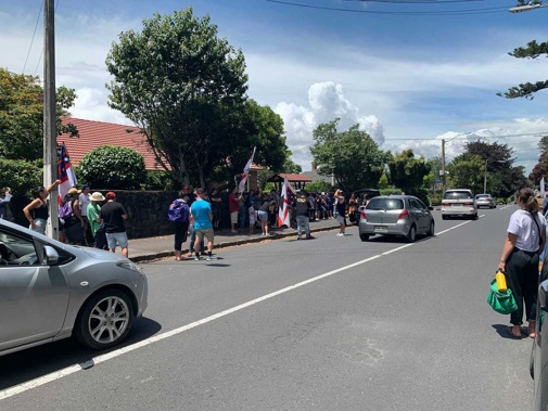 Protesters gather outside Government House in Auckland this morning. (Photo / Supplied)