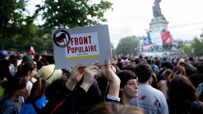 Supporters of the left wing union, New Popular Front, gather at the Place de la Republique on July 7, 2024 in Paris, France following the defeat of the far-right in France's legislative elections. (Photo by Nathan Posner/Anadolu via Getty Images)