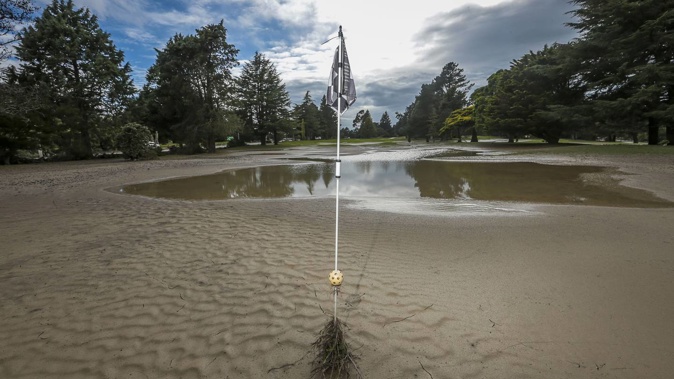 The 18th green at the Napier Golf Club, in the immediate aftermath of flooding. Photo / Paul Taylor