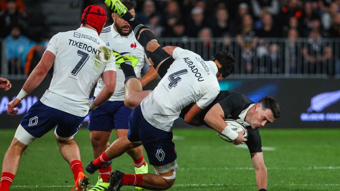 Will Jordan of New Zealand tackled by Hugo Auradou of France, New Zealand All Blacks v France, 1st Test match of the Lipovitan-D July Series against France at Forsyth Barr Stadium, Dunedin, New Zealand on Saturday 5 July 2025. Photo / Marty Melville | Photosport