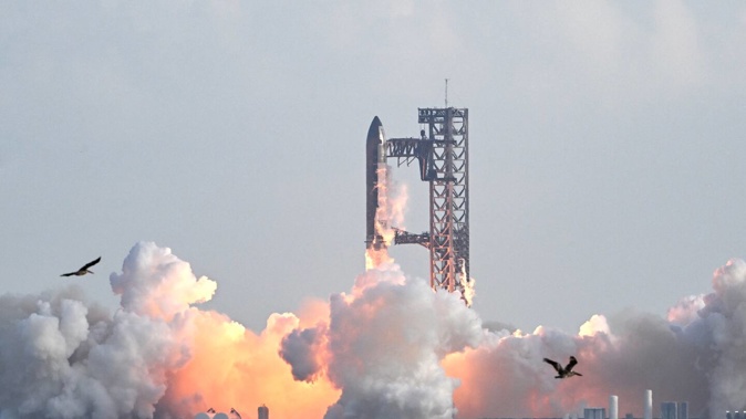 SpaceX's Starship megarocket roared into the skies today on its 10th test flight, following a string of explosive failures. Photo / Ronaldo Schemidt, AFP