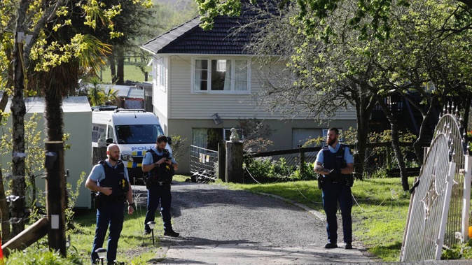 Police staff posted at the entrace of the Nga Kete bail facility in Dairy Flat, north of Auckland. Photo / Dean Purcell