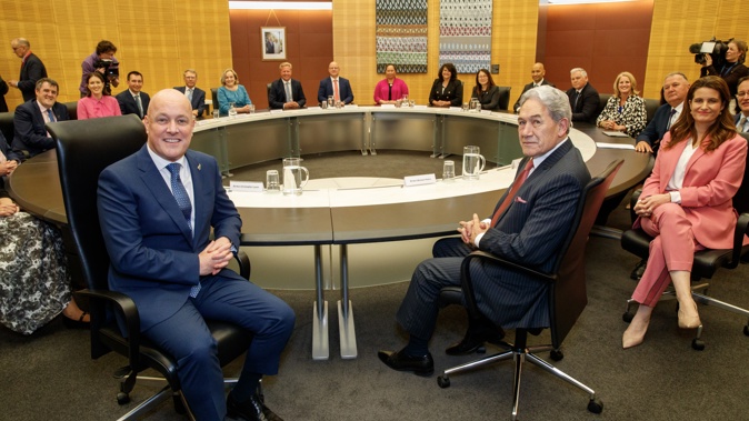 Prime Minister Christopher Luxon (left, front) and Deputy Prime Minister Winston Peters (right, front) ahead of the first Cabinet meeting. Photo / Mark Mitchell