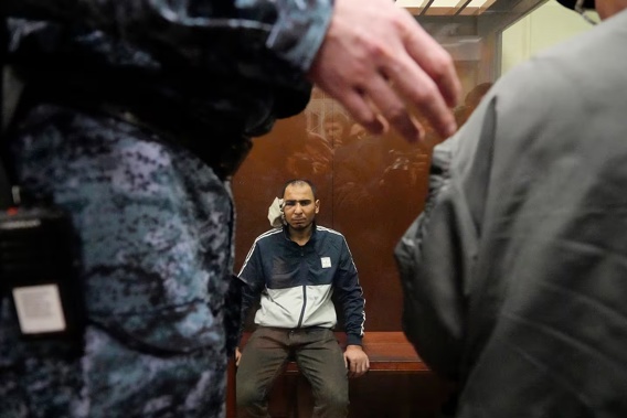 Saidakrami Murodali Rachabalizoda, a suspect in the Crocus City Hall shooting on Saturday, sits in a glass cage. Photo / AP