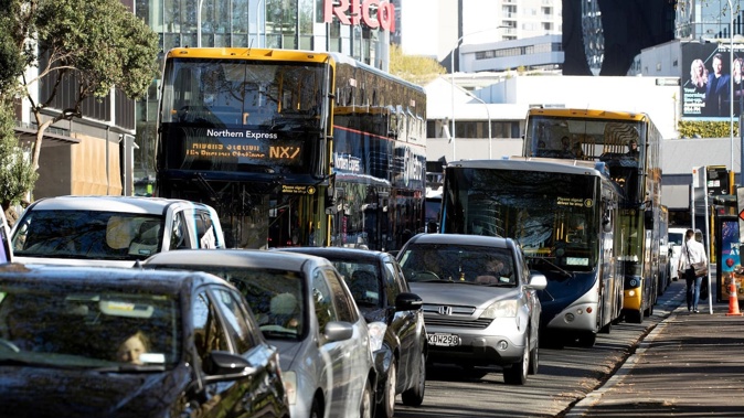 The Transport Emissions Reduction Pathway calls for halving car trips and a huge increase in public transport trips. Photo / Dean Purcell