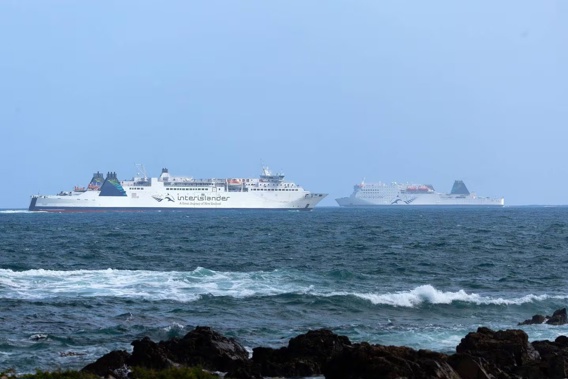 The Aratere passes its sister ferry Kaitaki at the harbour entrance in Wellington. Photo / Marty Melville