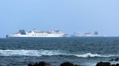 The Aratere passes its sister ferry Kaitaki at the harbour entrance in Wellington. Photo / Marty Melville