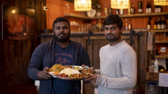 Ganesh Chowdhary Pulapa (right) with the manager of Baahubali Restaurant in Mt Albert. Photo / Dean Purcell