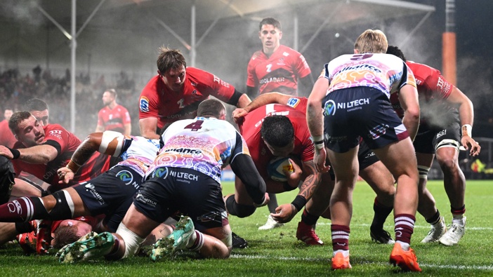 Tamaiti Williams of the Crusaders dives over to score a try during the Super Rugby Pacific Qualifying Final match between Crusaders and Qld Reds at Apollo Projects Stadium, on June 06, 2025, in Christchurch, New Zealand. (Photo by Joe Allison/Getty Images)