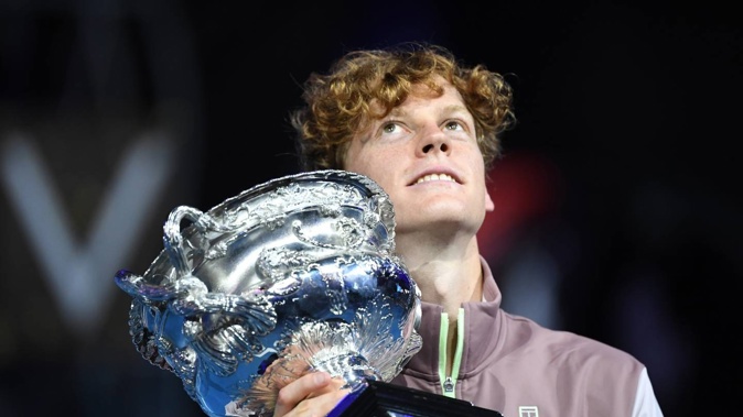 Jannik Sinner of Italy poses with the Norman Brookes Challenge Cup. Photo / Getty Images