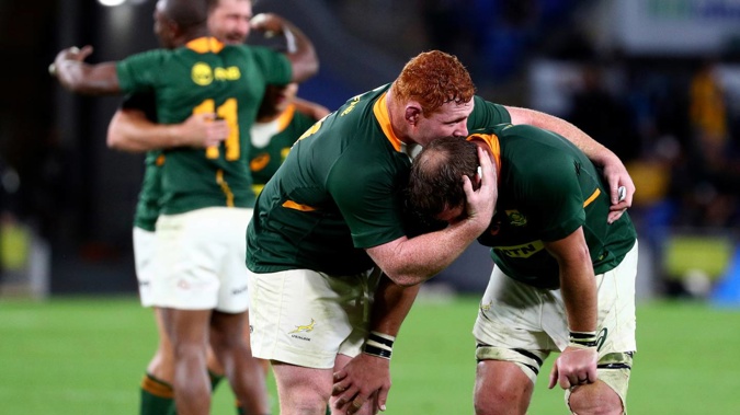 South African players celebrate their win over the All Blacks. (Photo / AP)