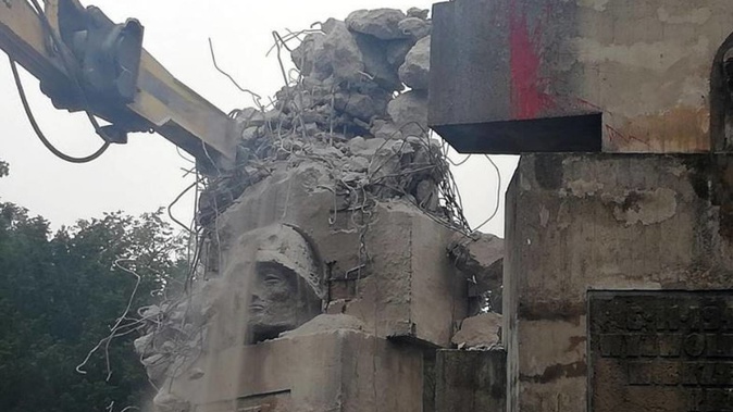 Workers begin to demolish a Soviet-era monument to the Red Army, in Brzeg, Poland. Photo / AP