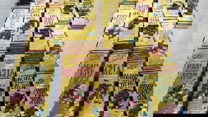 Some 50 blocks of Whittaker's chocolate allegedly stolen from a supermarket were found during a raid of an Auckland dairy. Photo / New Zealand Police