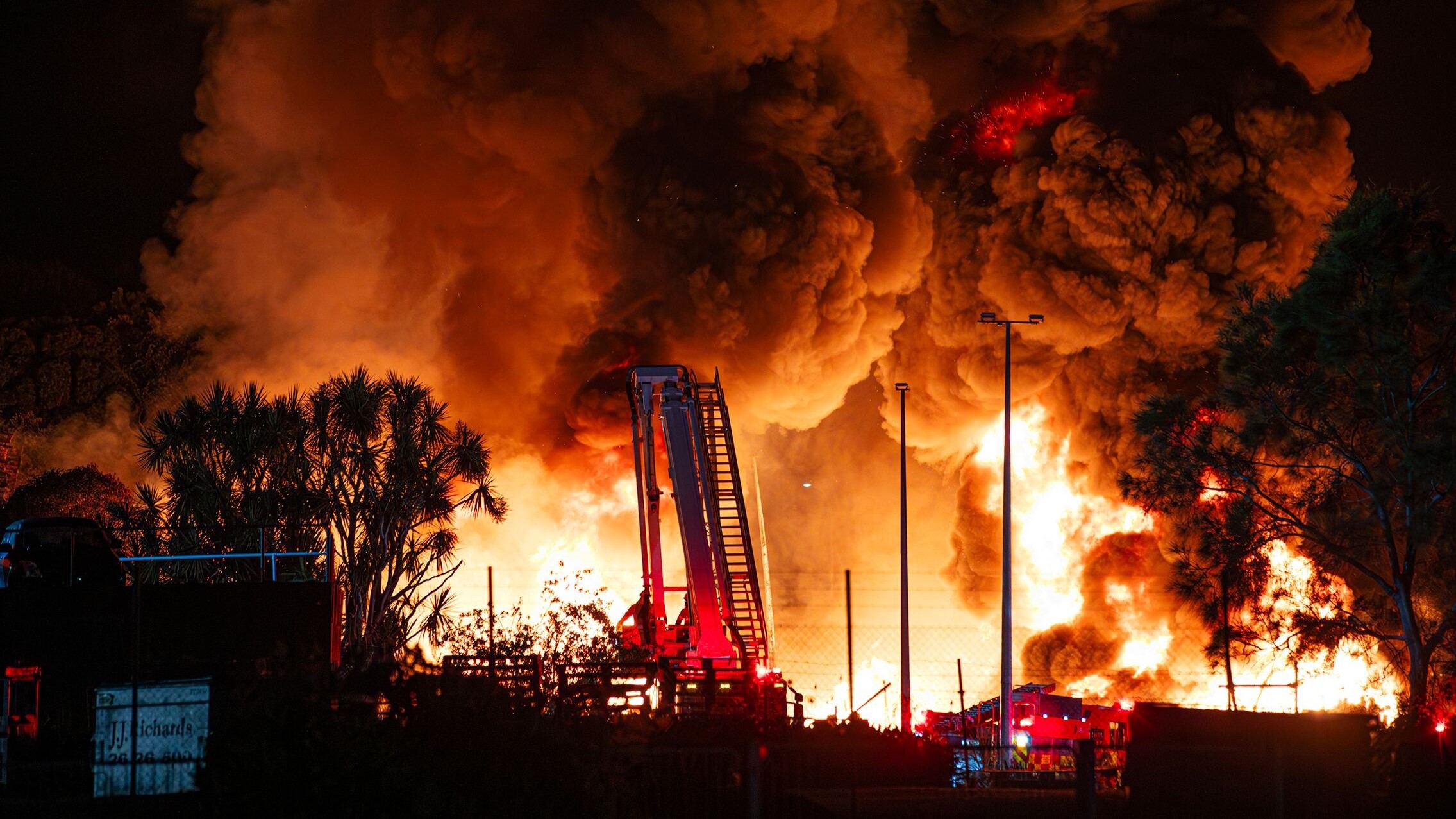 Huge clouds of smoke filled the skies over Waikuku last night. Photo / Hayden Woodward