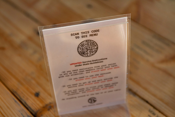 The QR code to see the virtual menu inside a pod tent is seen on Dec. 2, 2020, at Bien Trucha restaurant in Geneva, Illinois during the COVID-19 pandemic. (Brian Cassella/Chicago Tribune/Tribune News Service via Getty Images)