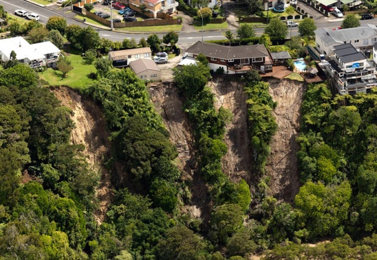 Landslides threaten homes in Massey, Auckland. Photo / Brett Phibbs