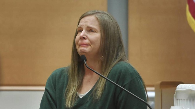 Alissa Parker, mother of deceased Sandy Hook Elementary School student Emilie Parker, breaks down in tears as she testifies in the Alex Jones defamation trial. Photo / AP
