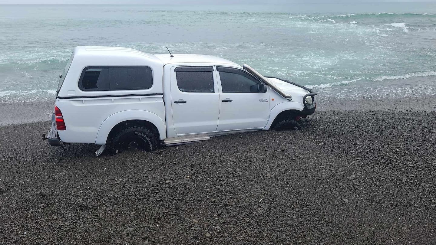 Ute driver fleeing police along beach arrested after getting stuck in sand