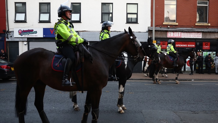 Police on horses patrol as anti-racism counter protesters gather ahead of a potential anti-immigration protest on August 7, 2024 in Preston, England. Photo / Getty