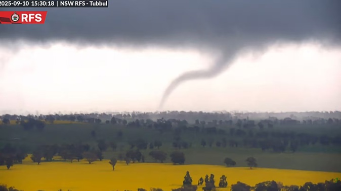 An Australian fire surveillance camera captured dramatic video images yesterday of a tornado towering over a thunderstorm-struck stretch of countryside. Photo / Handout, NSW Rural Fire Service, AFP