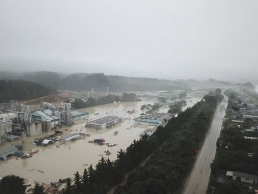 An aerial photo showing extensive flooding at the Pan Pac Forest Products mill at Whirinaki after Cyclone Gabrielle hit.