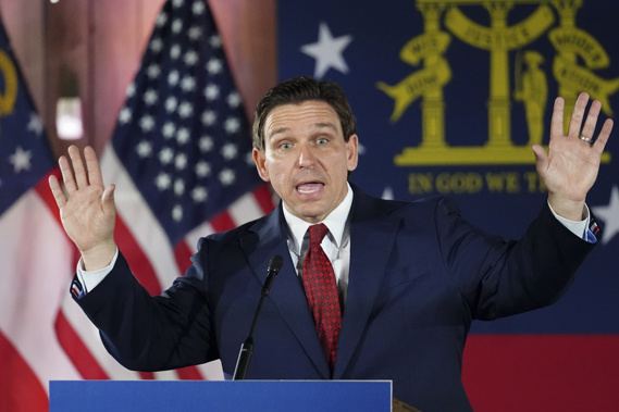 Florida Gov. Ron DeSantis speaks to a crowd at Adventure Outdoors gun store. Photo / AP