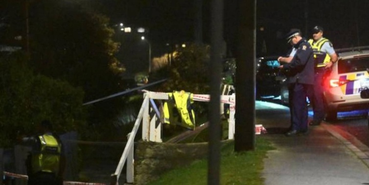 Police attend the scene of an unexplained death in Tainui Rd, Dunedin, yesterday. Photo / Linda Robertson