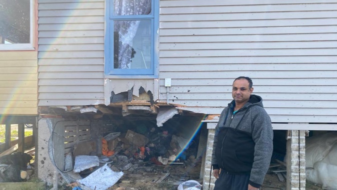 Homeowner Niraj Prasad was startled late last night when a car lodged into his home. Two occupants of the car died in the crash. (Photo / Nick James)