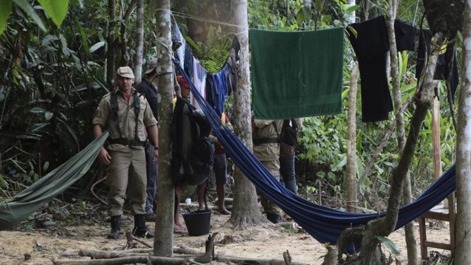 Firefighters arrive at a camp set up by Indigenous people to search for Bruno Pereira and Dom Phillips. (Photo / AP)