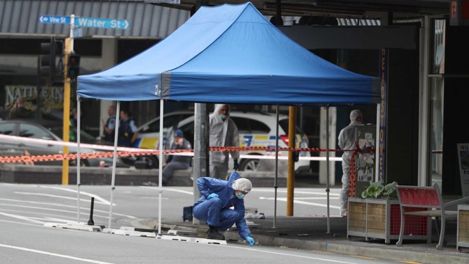 A forensic team carrying out a scene examination as part of a homicide investigation launched after a man was killed on Saturday night. (Photo / Michael Cunningham)