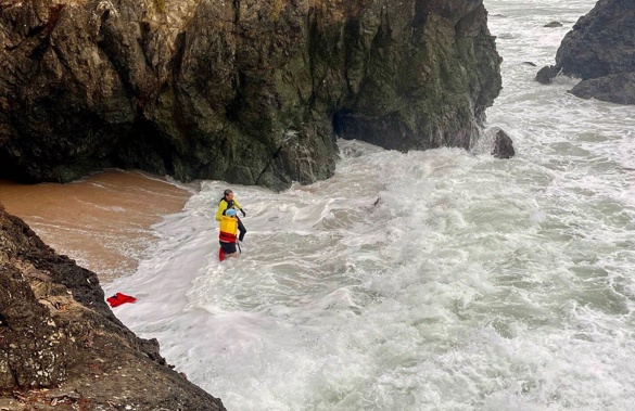 Waipu Cove surf lifeguard Rick Stolwerk helps to rescue the family stuck inside a cave between Ding Bay and Langs Beach.