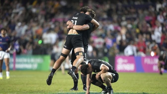 New Zealand's players celebrate after winning the men's final match against France in the Hong Kong Sevens. Photo / AP
