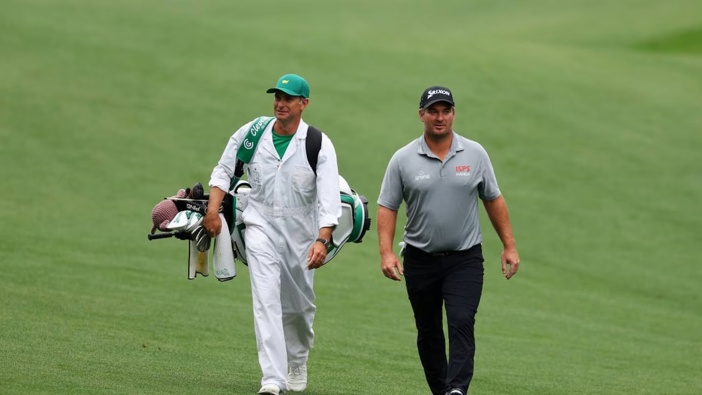 Ryan Fox walks up the 13th fairway with his caddie, Dean Smith, during a practice round prior to the 2023 Masters. Photo / Getty