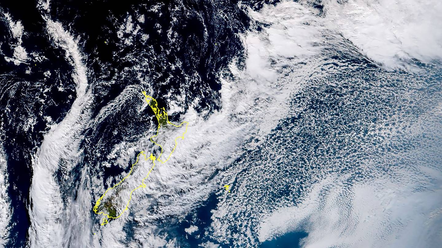 This satellite image shows a low pressure system funneling heavy rain onto the North Island's East Coast today. Another system is forecast to arrive later this week. Photo / JMA