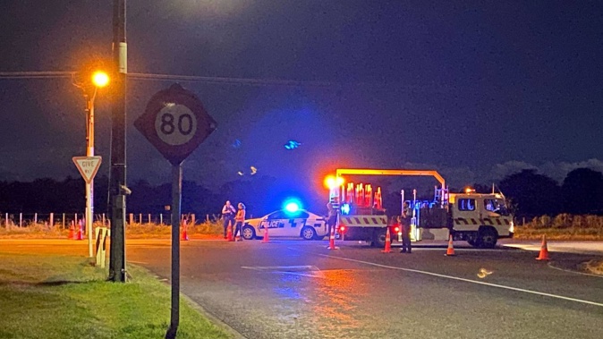 Police cordoned off the road after a person was shot by police in New Plymouth last night. Photo / Tara Shaskey