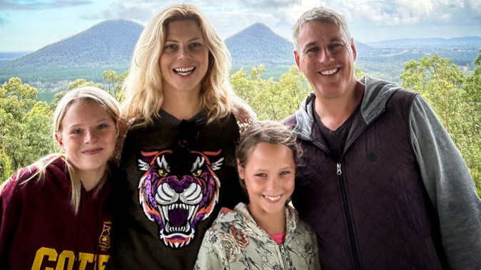 Adrienne Smithson, who has been diagnosed with stage 4 bowel cancer, with her husband James and daughters Dominique (13) and Casey (10).