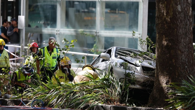A car has crashed outside the University of Auckland, with several people injured. Photo / Michael Craig