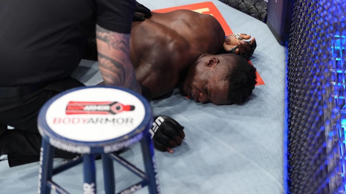 Mike Mathetha aka 'Blood Diamond' lies on the canvas after being submitted by Jeremiah Wells in their welterweight fight during the UFC 271 event at Toyota Centre. Photo / Getty Images