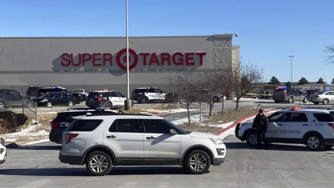 Omaha police officers gather outside a Target store in Omaha on Tuesday. Photo / AP