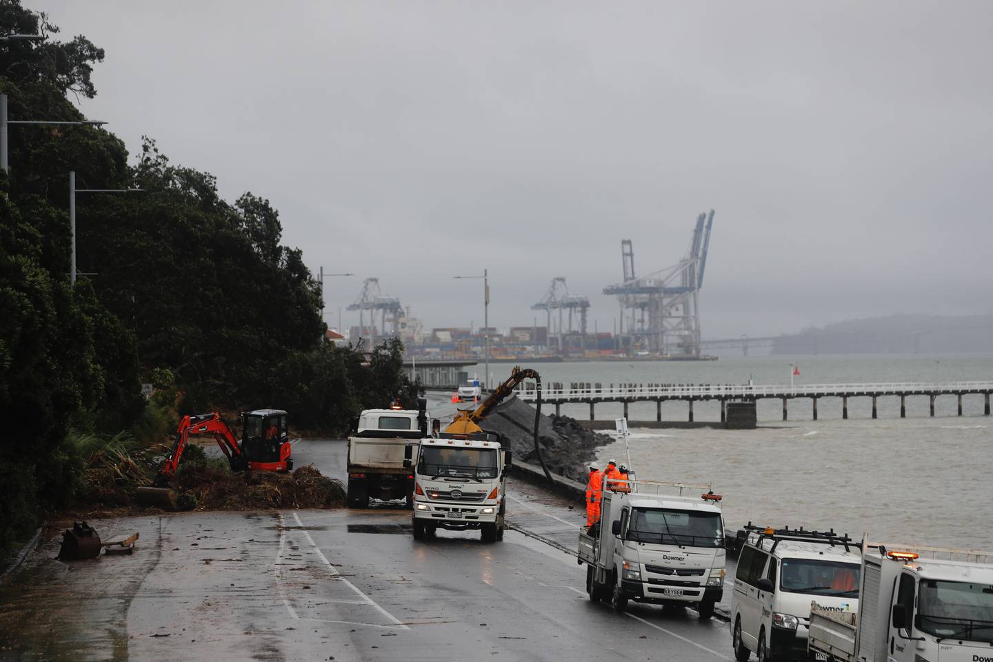 Workers are clearing a large slip on Tamaki Drive between Okahu Bay and Mission Bay. Photo / Dean Purcell