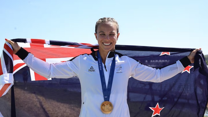 Dame Lisa Carrington celebrates her eighth Olympic gold medal. Photo / Photosport