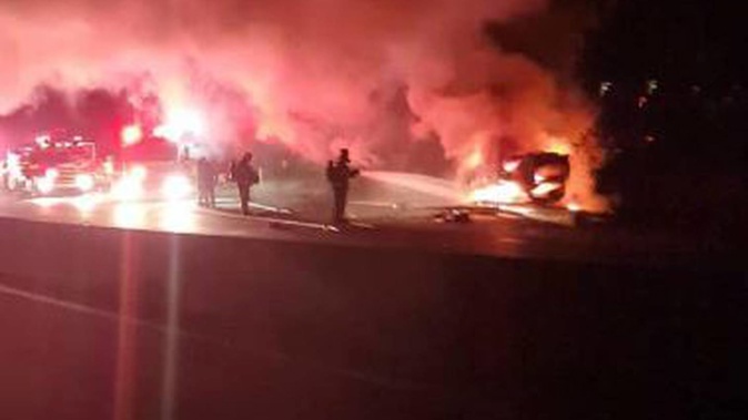 The car burst into flames after crashing into a power pole on State Highway 2 at Horokiwi.