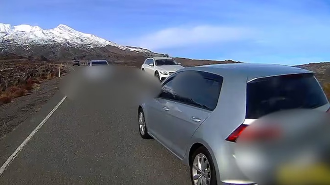 The close call. Somehow the hatchback avoided the oncoming vehicle and the shuttle it was overtaking on Whakapapa access road. Photo / Supplied