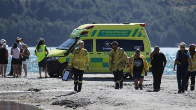 Emergency services at the scene on the shore of Lake Wakatipu in Glenorchy. Photo / Rhyva van Onselen