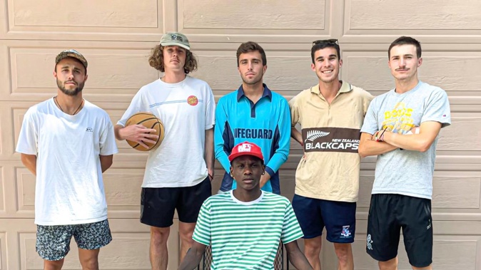 Matt Walsh (second left), Mitchell Small (middle) and Murdoch McIntyre (far right) with the three other Kiwis in their household who have tested positive for Covid-19. (Photo / Supplied)