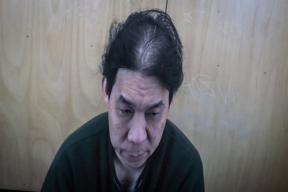Ee Kuoh Lau, also known as Augustine Lau, appears in Auckland District Court via audio-video feed as he is sentenced for multiple counts of meeting a young person following sexual grooming. Photo / Michael Craig