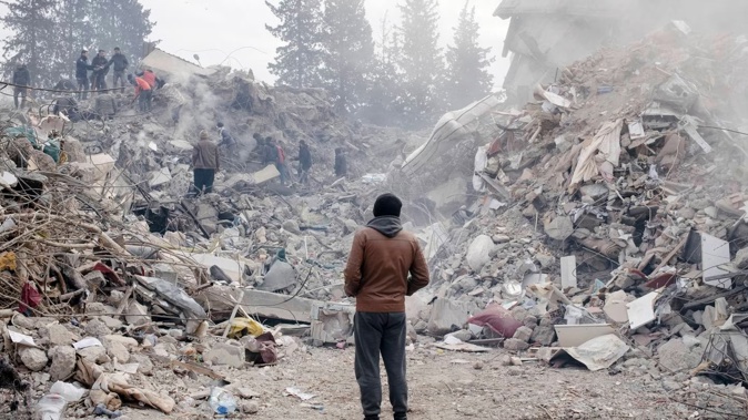 People search for their relatives in a collapsed building in Kahramanmaras. Photo / Emin Ozmen, The New York Times