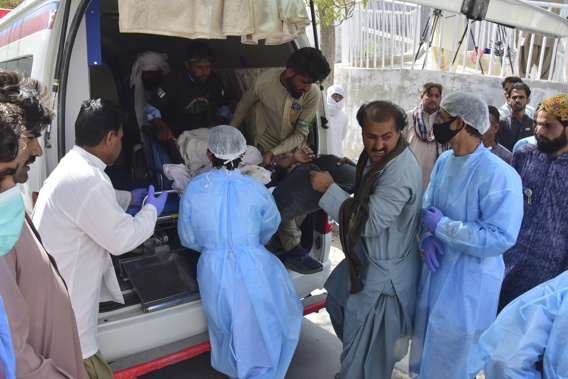 Paramedics and volunteers carry an injured victim of a bomb explosion upon arrival at a hospital, in Quetta, Pakistan, Friday, Sept. 29, 2023. Photo / AP