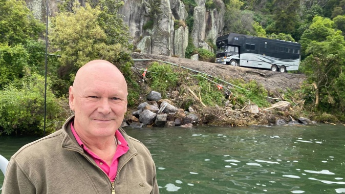 John McCallum checks on the site of a truck crash at Te Poporo near Taupō where tonnes of krill oil and packaged meat fell into the water. Photo / Dan Hutchinson